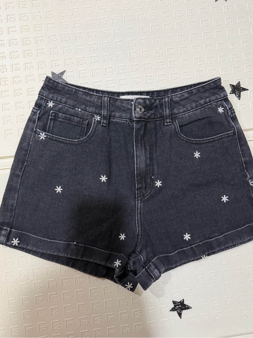 PacSun Black Denim Shorts with White Daisy Stitching